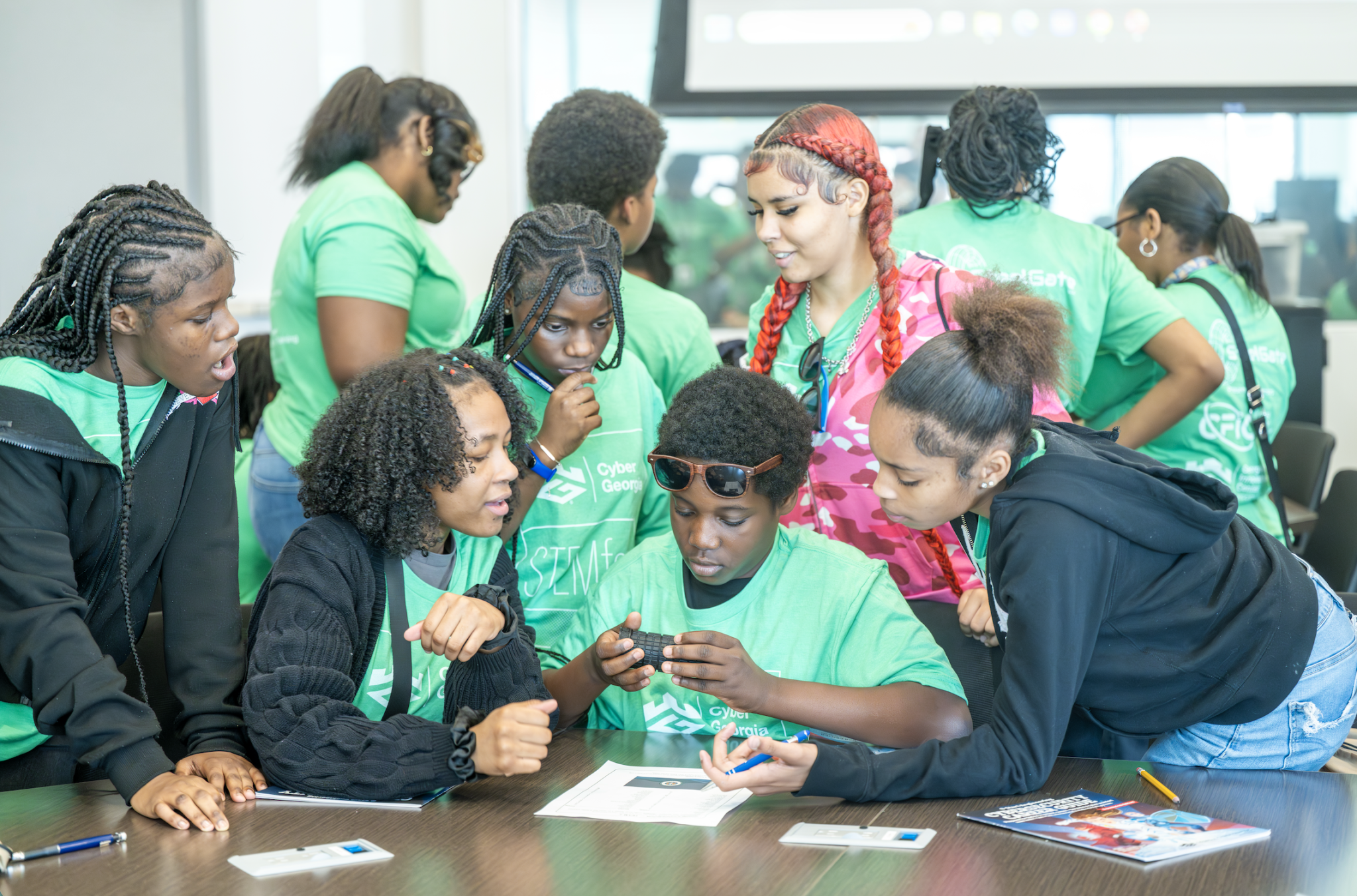 Middle school students in cyber escape room at Cyber Georgia STEMFest at Georgia Cyber Center