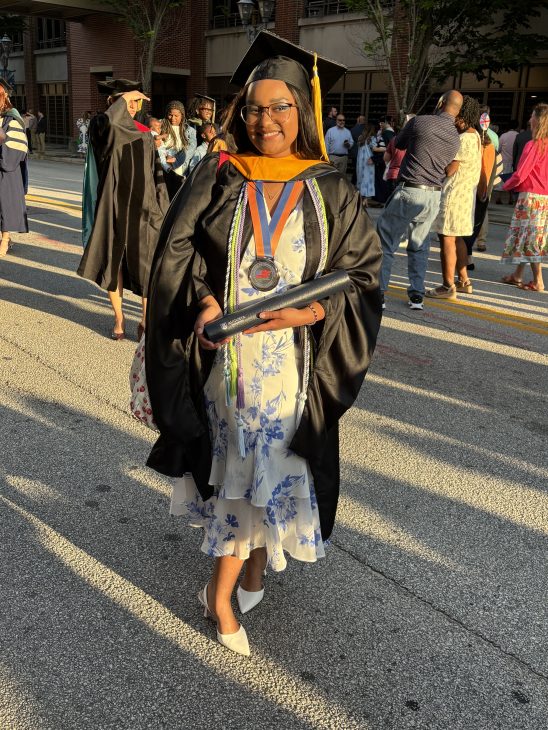 Graduate at graduation with degree in cybersecurity from Georgia Cyber Center at Augusta University