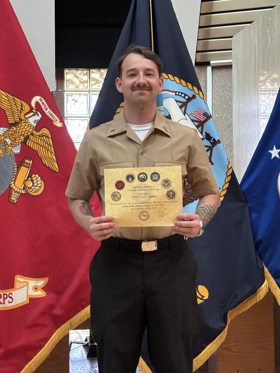 Man at navy graduations, alumni from Georgia Cyber Center