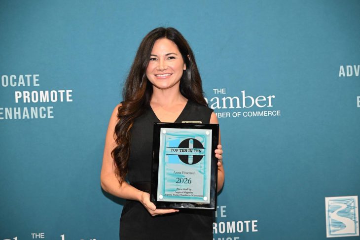 Woman holding award