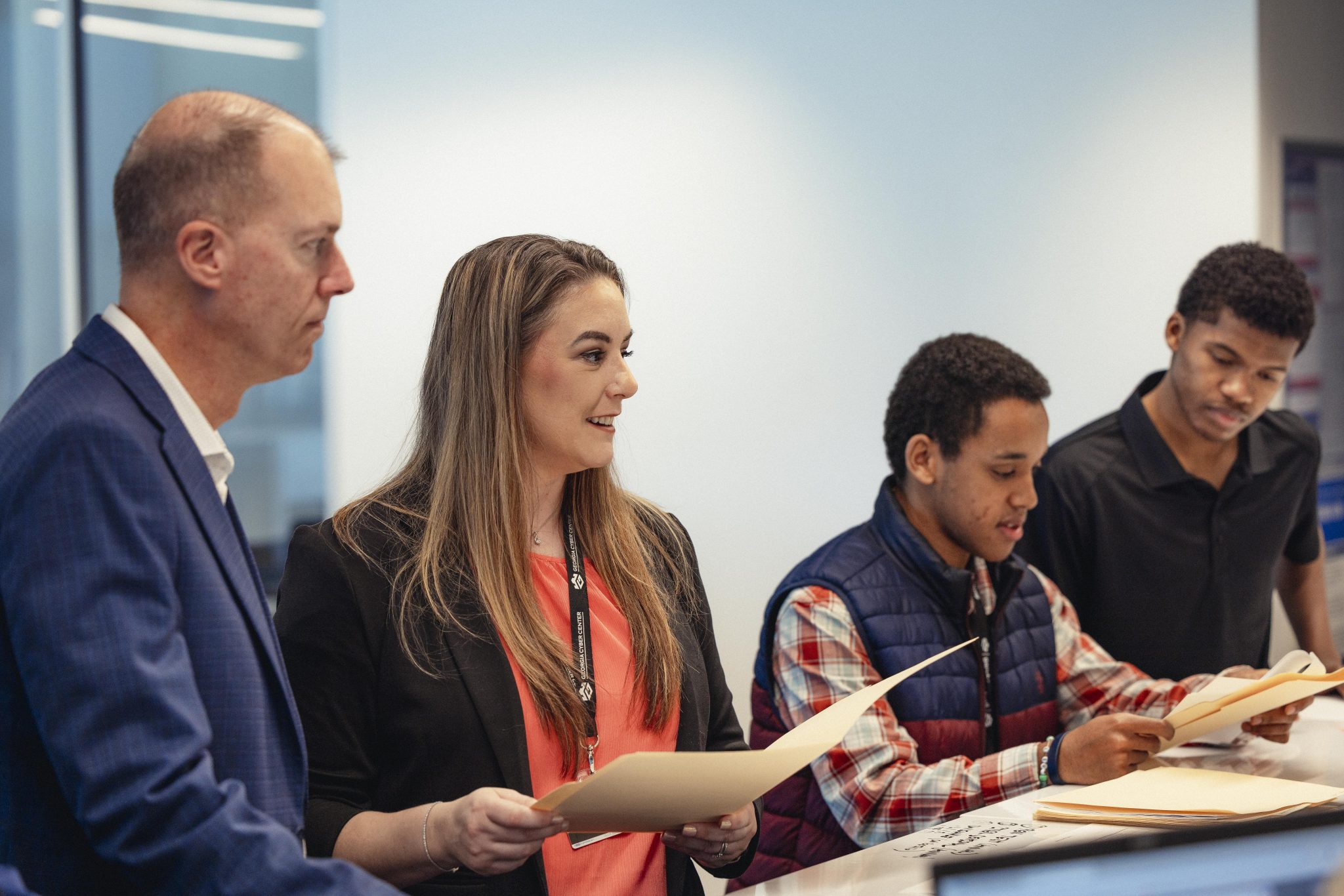 Student workforce in our Cyber Resiliency Center working as a team to help protect small businesses in Georgia