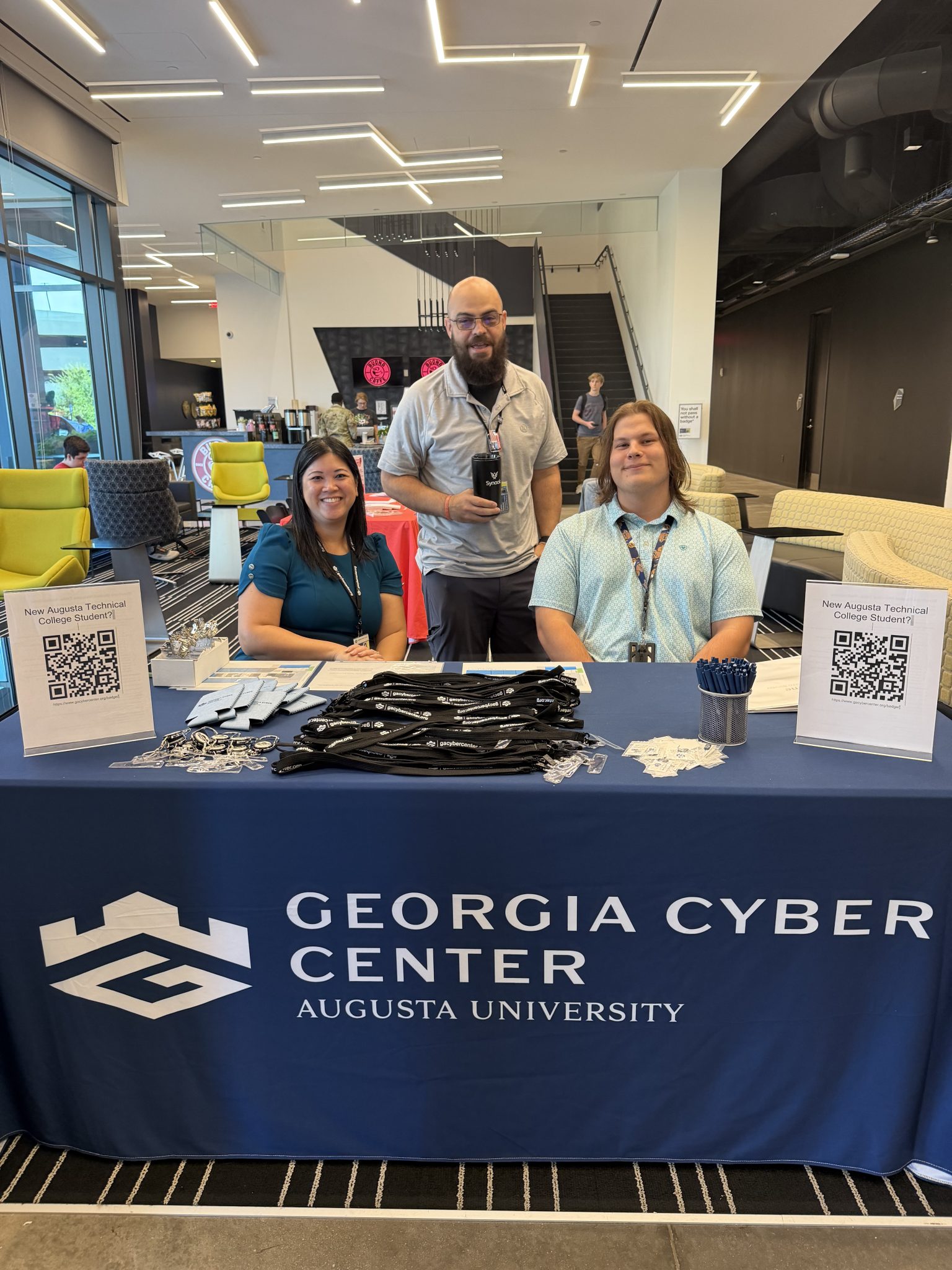 Georgia Cyber Center employees welcoming back Augusta University and Augusta Technical College students in the GCITC lobby