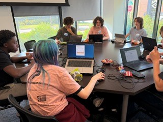 students partaking in capture the flag exercise on computers in the Georgia Cyber Center virtual world