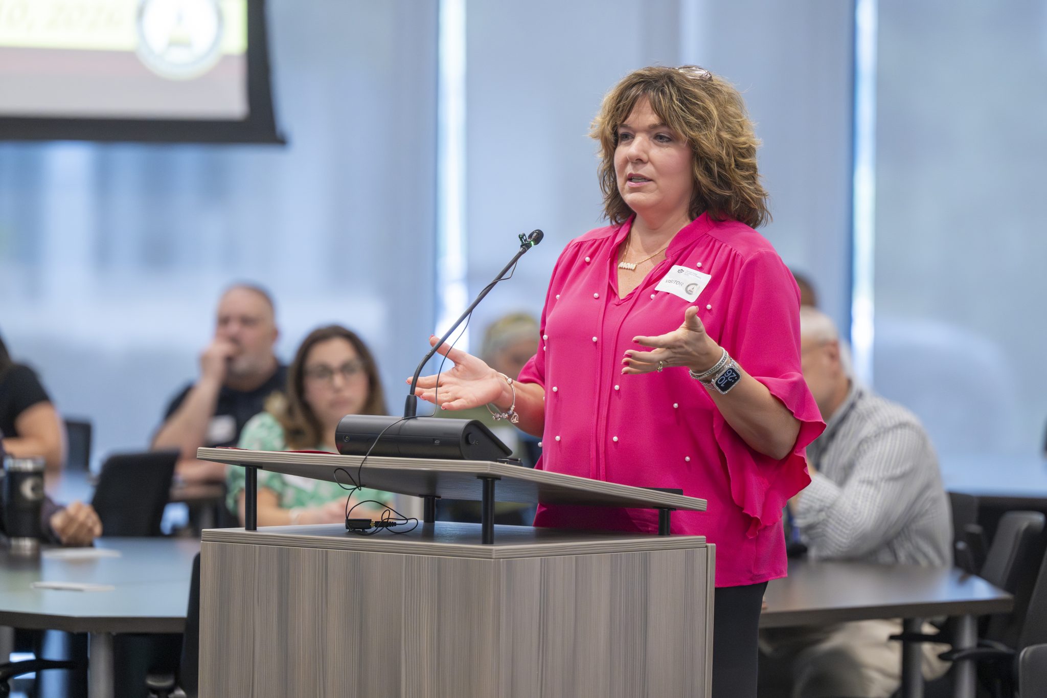 Georgia resident (female) speaking to house committee during meeting at the Georgia Cyber Center