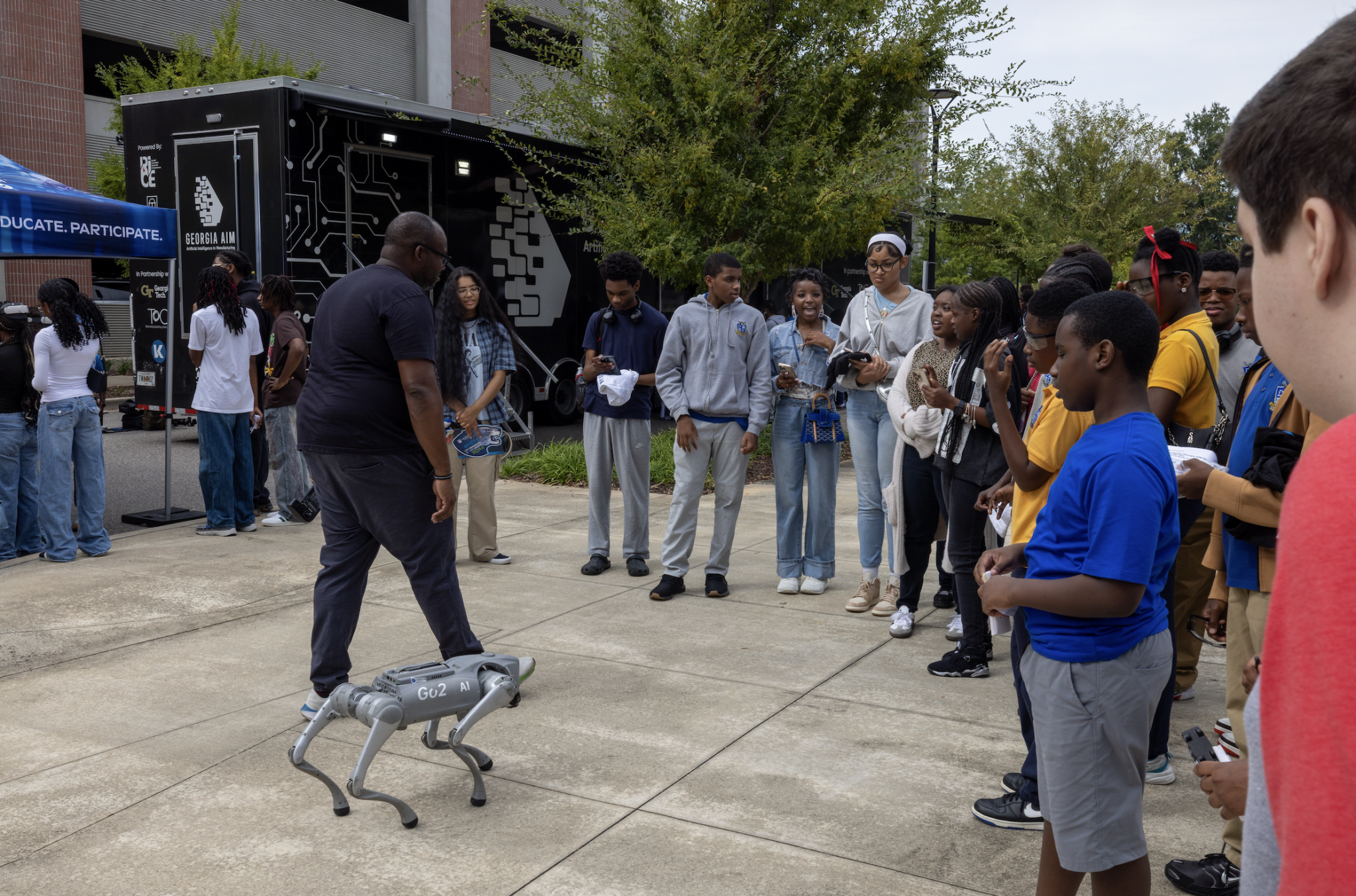 Robotic dog demonstration in front of Georgia AIM mobile studio
