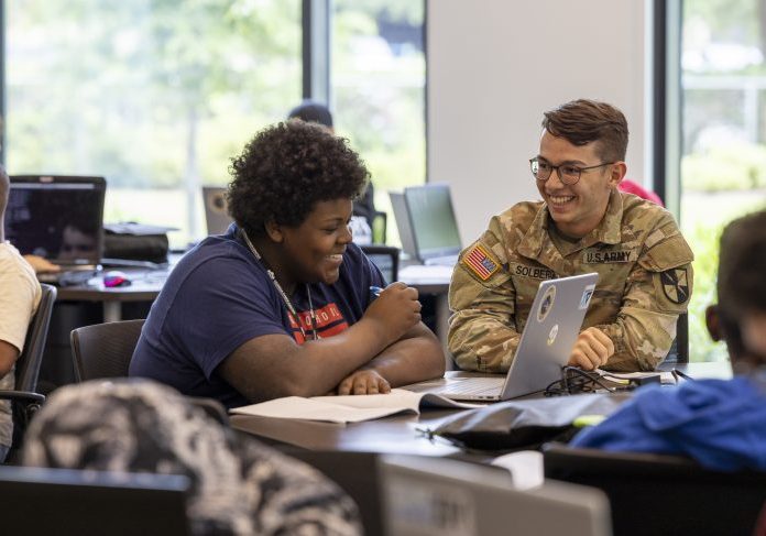 Cyber Patriot students learning and doing hands-on activities at the Georgia Cyber Innovation & Training Center alongside the Alliance for Fort Gordon