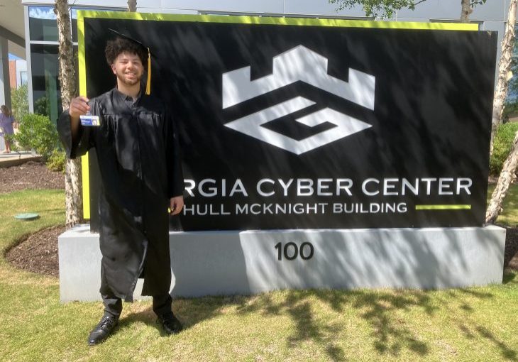 Man next to sign