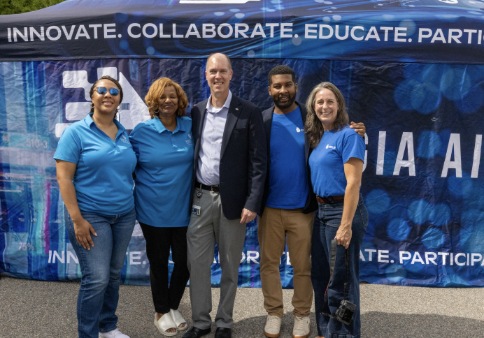 Eric Toler and Georgia AIM staff standing in front of RICE Georgia AIM Mobile Studio
