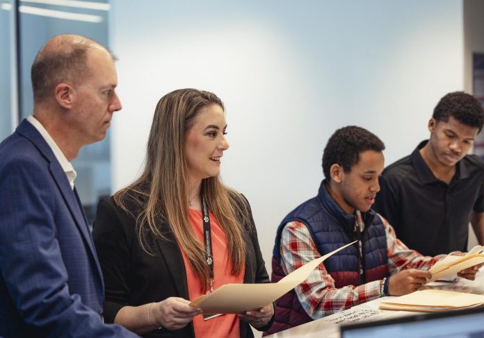 Student workforce in our Cyber Resiliency Center working as a team to help protect small businesses in Georgia
